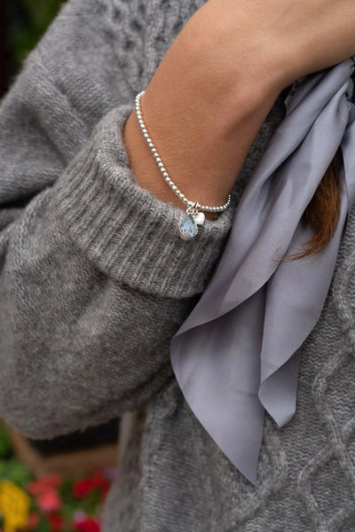 Forget-me-not necklace by Shrieking Violet® Sterling silver teardrop pendant with real forget-me-nots. Ideal for Mothers day or bridesmaid jewellery.